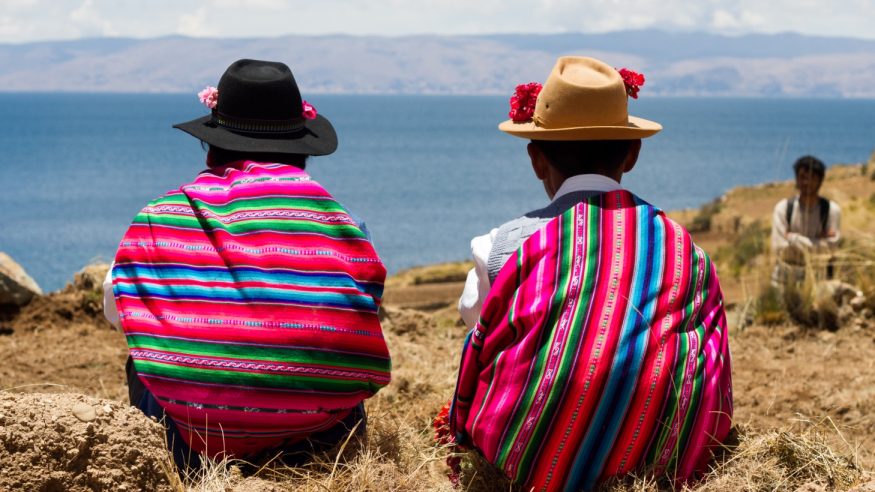 Native couple watching the lake in Bolivia