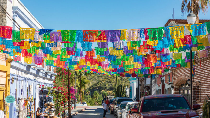 Todos Santos, Baja California Sur, Mexico. November 11, 2021. Colorful banners over a street in Todos Santos.