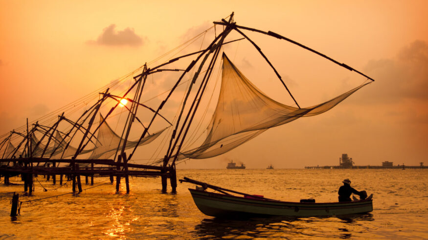 Sunset over Chinese fishing nets and boats in Kochi