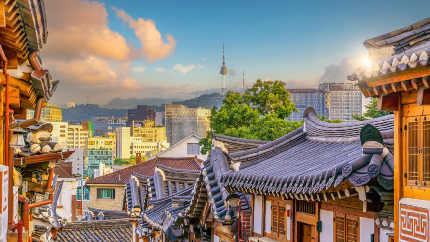 Bukchon Hanok Village with Seoul city skyline, cityscape of South Korea at sunset
