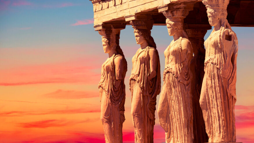 Detail of Caryatid Porch on the Acropolis uring colorful sunset in Athens, Greece. Ancient Erechtheion or Erechtheum temple. World famous landmark at the Acropolis Hill